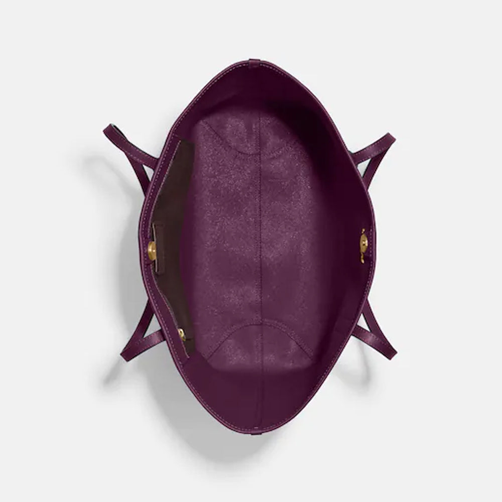 coach boysenberry backpack Court With Strawberry Print Crafted of Signature canvas and smooth leather this backpack features an interior laptop sleeve inside pockets and an outside zip pocket for ample storage Coach Mini Court Backpack With