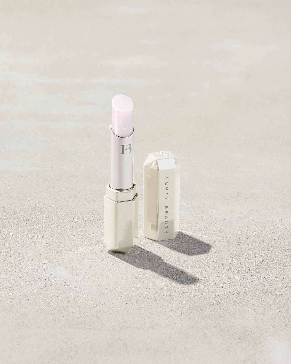 Fenty Beauty- SLIP SHINE SHEER SHINY LIPSTICK (Quartz Candy Clear With Pink Iridescence)