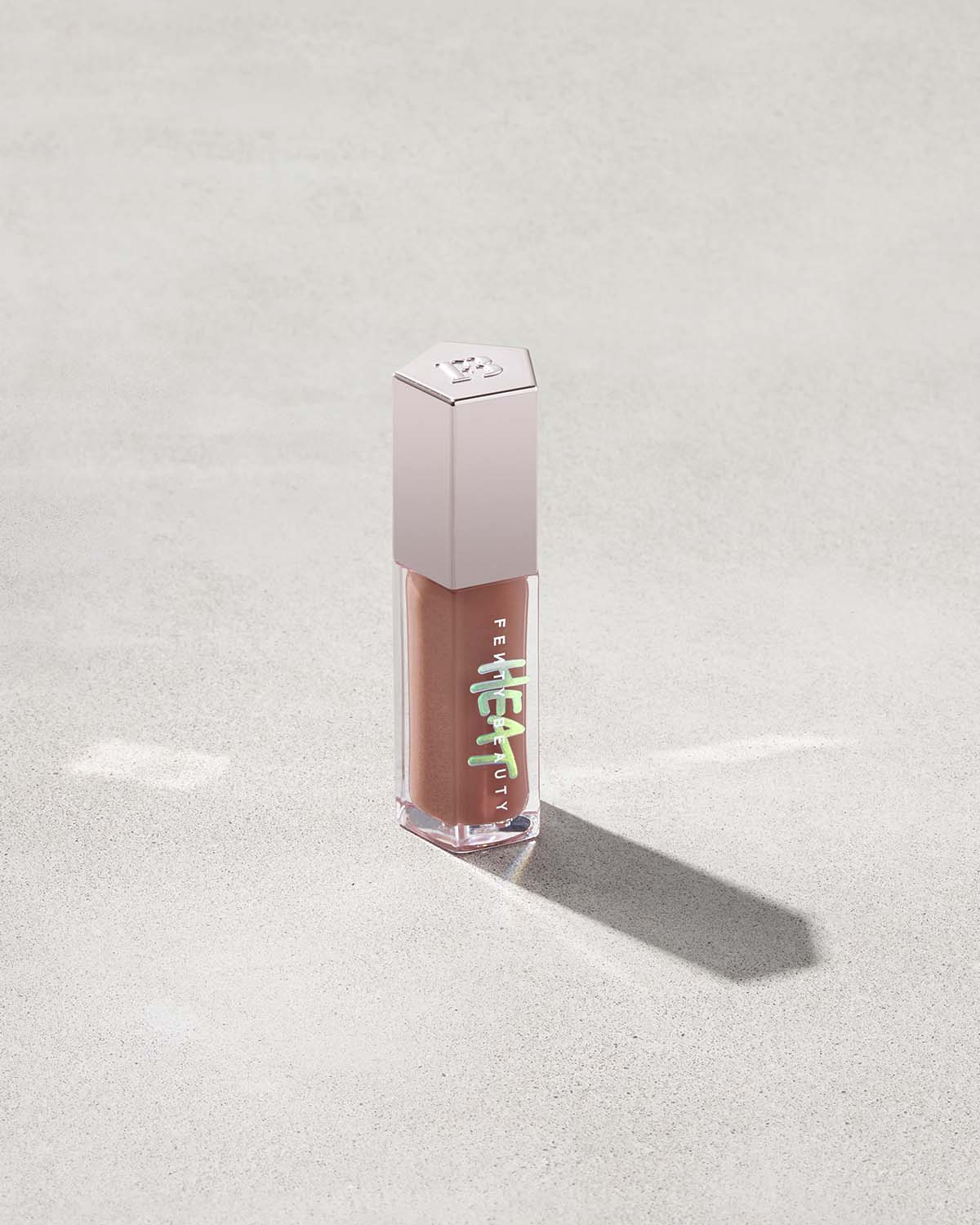 Fenty Beauty- GLOSS BOMB HEAT UNIVERSAL LIP LUMINIZER + PLUMPER (Fenty Glow Heat sheer rose nude)